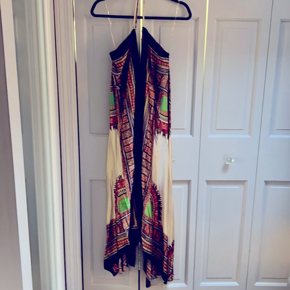 A satin handkerchief dress with halter top and open back